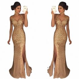 Vente chaude 2024 Plus Taille Solide Couleur Élégante Femmes Lg Jupe avec col en V Fente Industrie lourde Paillettes d'or Moyen-Orient Dr W8TE #