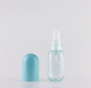 Venta caliente Cosméticos vacíos Forma de cápsula de plástico recargable 40ml 60ml Botella de spray cosmético Maquillaje Cara Atomizador fino Botellas de loción JL1017