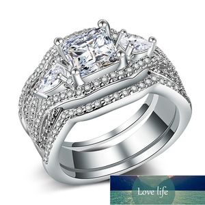 Huitan Juego de anillos de boda de lujo de 3 piezas con circonita cúbica de corte marquesa, chapado en plata, anillos de pareja, regalo para amantes para mujeres