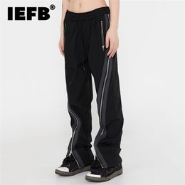 IEFB Streetwear Chic Side Full Zip pantalones casuales Vibe estilo suelto acampanado para hombres cintura elástica pantalones de primavera 9Y9009 220328