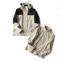 In jas voor mannen en vrouwen in de herfst Winter Fashionable Outdoor Mountain Leisure Warm Hooded Jacket