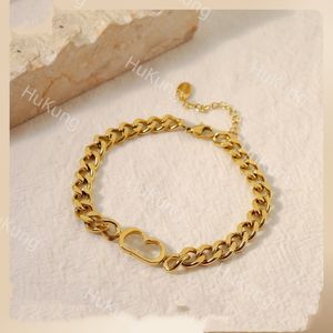 INS Réseau européen et américain Bracelet en acier titane rouge incolore, simple et polyvalent, pièce à main en chaîne cubaine plaquée or véritable 18 carats pour femme