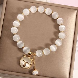 Instagram Estilo coreano Cat Eye Crystal Single Loop Fashion Joya de pulsera de perlas de agua dulce para mujeres