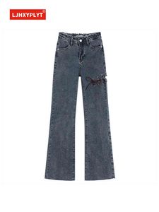 Trou de laçage irrégulier bleu jeans femmes été nouvelle taille haute mince bord brut vadrouille pantalon uni femme pantalon en jean décontracté T220728