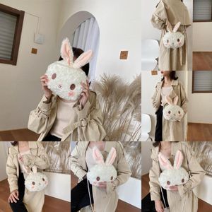 Sac en peluche de lapin mignon japonais Version coréenne femelle du sac d'étudiant de dessin animé Sac à bandoulière Perle Bouche d'épaule laid