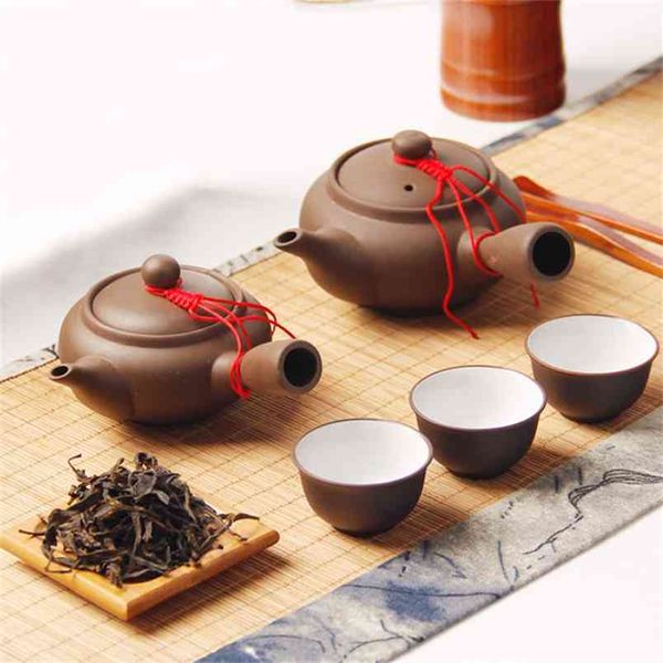 Tetera hecha a mano de arcilla púrpura de estilo japonés, conjunto chino, tetera creativa de Kung Fu para oficina, olla de filtro con mango lateral de cerámica 210813