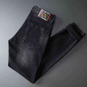 Jeans automne hommes coupe ajustée petits pieds International spécial coréen brodé pantalon à la mode