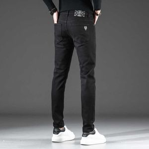 Jeans noir pour hommes et hiver styles d'automne mode européen Version coréenne Casual polyvalent élastique slim fit leggings épaissis