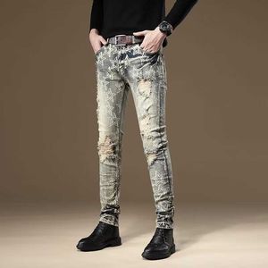 Jeans à la mode taille moyenne tendance jeunesse paresseuse lavé style printemps coupe slim petit pied pantalons longs pour hommes