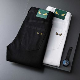 Jeans heren 2022 zomer dunne stretch slank fit kleine voeten Koreaans zwart en wit borduurwerk casual broek mode
