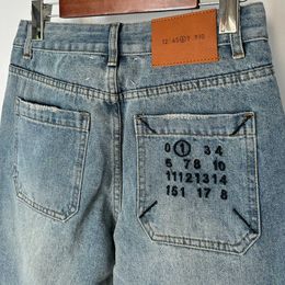 jeans femmes 2024 vente chaude M6 Magi poche arrière avec broderie numérique simple et en détresse pantalon en denim jambe droite étroite tendance femme