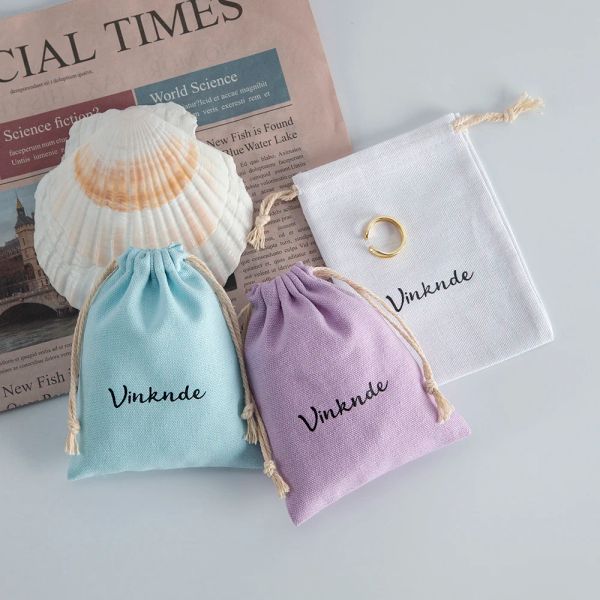 Joyería 100 unids/lote bolsas de algodón Natural con logotipo personalizado aptas para regalo de boda bolsa pequeña de dulces pestañas maquillaje joyería bolsita con cordón