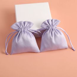 Bijoux 50pcs Flanelle Sac de bijoux de mariage Favors pour les invités Sacs à cordons en vrac