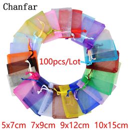 Bijoux Stand 100 pcs 24 Couleurs Emballage Sac 57 79 912 1015 cm Organza Sacs Cadeau De Stockage De Mariage Cordon Pochettes En Gros 230517