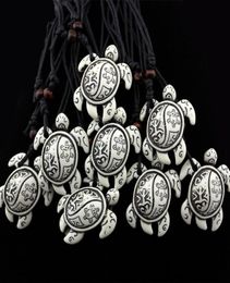 Bijoux entier 12pcslot tact tribal totem faux osse bos frogs sculpnet soleil tortue collier pendant talisman talisman gift8186037