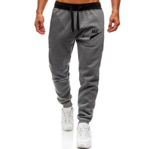 Jogging broek mannen lopende broeken met sport fitness panty gym jogger bodybuilding zweetwegen sport mannelijke broek merk logo print