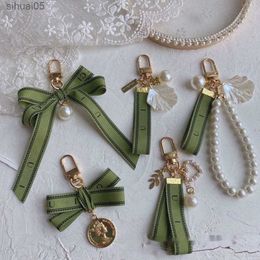 Llavero de diseño clave Llavero de lujo Llavero femenino Cinta verde perla Conchas delicadas Llavero GGG 240303