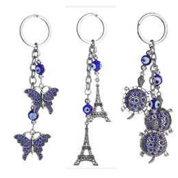 Llaveros Azul Mal de ojo Llavero Anillo Joyería Tortuga Torre Eiffel Llavero Moda Animales Mariposa Encantos Titular de cadena para bolsos Dhnwt