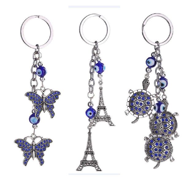 Porte-clés Blue Evil Eye Porte-clés Bague Bijoux Tortue Tour Eiffel Porte-clés Mode Animaux Papillon Charms Porte-chaîne pour sacs à main Dhnwt