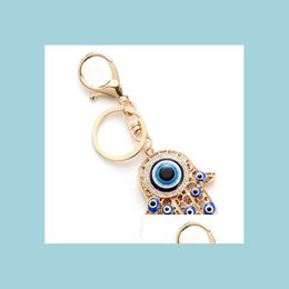 Key Rings Hollow Fatima Hamsa Hand Turkije Blue Eyes Key Chain Alloy Glass Evil Eye Keychains Auto Handtassen Accessoires Lobst MJfashion DHTSA