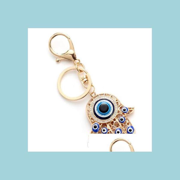 Llaveros Hollow Fatima Hamsa Mano Pavo Ojos Azules Llavero Aleación Vidrio Mal de Ojo Llaveros Bolsos de Coche Accesorios Langosta Mjfashion Dhtsa