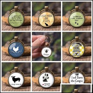 Porte-clés Bijoux Mignon Animal Impression Chaînes Chien Chat Griffe Patte Empreintes Verre Cabochon Pendentif Bague De Voiture Cadeaux Créatifs Pour Hommes Drop Delive