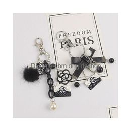 Porte-clés perle camélia porte-clés classique rétro fait à la main sac noir et blanc pendentif décoratif livraison directe bijoux Dhubz