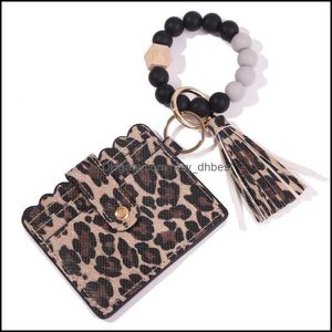 Sleutelringen Sil kralen Key Ring Strands Bracelet Polschain met Cheetah Leopard Leather Tassel ID Kaart Portemonnee Purse Men Women Ha Dhmzi