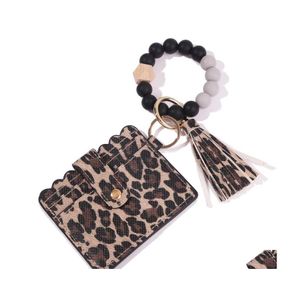 Sleutelringen Sil kralen ringstrengen Bracelet Polschain met Cheetah Leopard Leather Tassel ID Kaart Portemonnee Men Men Women Handm Dhjxw