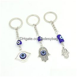 Sleutelhangers Groothandel Ronde Cilinder Keramiek Blauw Turks Boze Oog Sleutelhanger Autosleutelhanger Lucky Eyes Hamsa Hand Sleutelhanger Voor Vrouwen Mannen J Dhxal