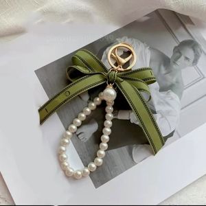 porte-clés designer porte-clés luxe porte-clés charme femme voiture porte-clés perle charme ruban vert coquilles délicates porte-clés couple pendentif cadeau