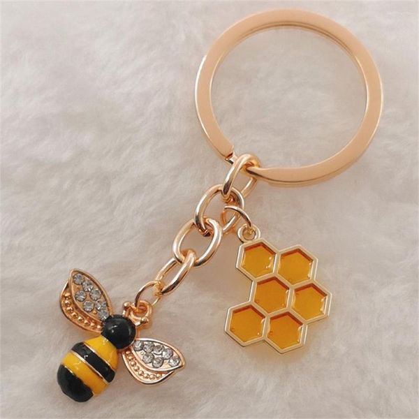 Porte-clés 1pc mignon femmes hexagone nid d'abeille goutte à goutte huile strass abeille porte-clés couple insecte porte-clés sac ornement accessoires