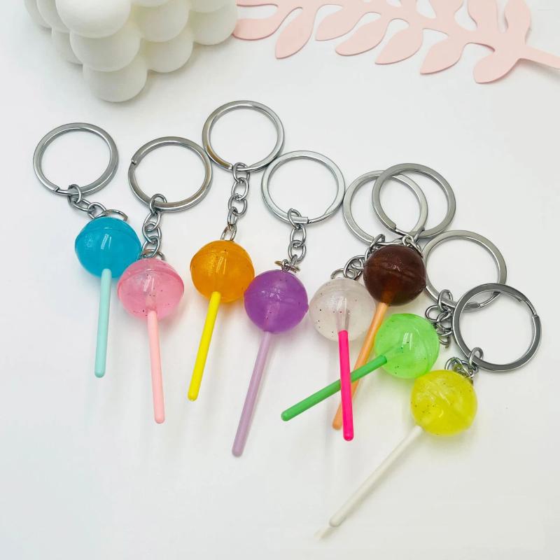 Chaves 1pcs Simulação Lollipop Keychain transparente Acessórios de resina luminosa Ornamentos de bolsas de doces Creative Gifts Spot.Cor aleatória