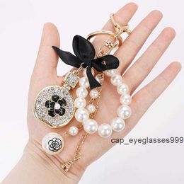 Keychains Bow-not imitation Perfume Perfume Crystal Bottle Tower Chain Keadchain Car Key Anning Sac CHARM ACCESSOIRES FILLE CAVET