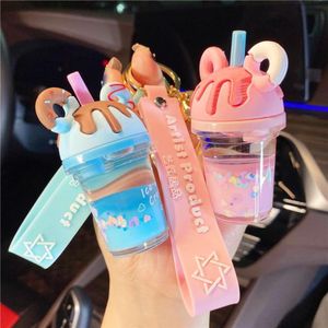 Llaveros creativos lindos chica corazón líquido en la botella de aceite taza de té de la leche llavero flotante hombres mujeres coche colgante joyería 9874429282t