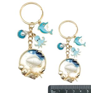Keychains Creative Lovely Dolphin and Sea Shell Key Rings Charms Fashion Huile Drop Cavyring Femme Bag Ornements Accessoires pour l'anniversaire de Noël Cadeau de la Saint-Valentin