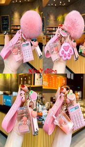 Keychains Bottle de lait créatif Crystal Keychain mignon Boule velue couleuse liquide Key Key Computer Nail Clipper sac Pendant 7710290