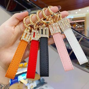 Keychains Designer Metal Diamant Leather Keychain Car Key Chain Hook KeyChain Kneep Keychain Letters Round Gold Bag Key Chain Mobiele telefoon Charme Goed leuk