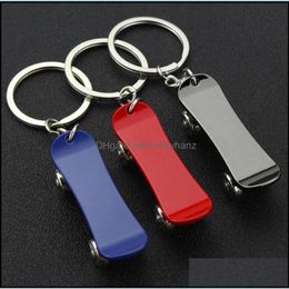 Keychains mode aessories sport roteerbare skateboard sleutelhanger sleutelringen houders skate bord tas hangen gwe11663 drop levering 2021 s3p1n