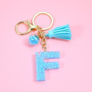 Keychains Fashion Blue Tassel A-Z Letters Initiële hars sleutelhangers ringen handtas hanger schattige auto sleutelen charme tas accessoireskeychains