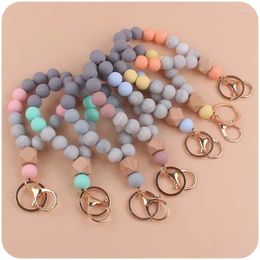 Porte-clés mode femmes hommes anti-goutte porte-clés coloré bois silicone perlé porte-clés pour bracelet pendentif bijoux en gros