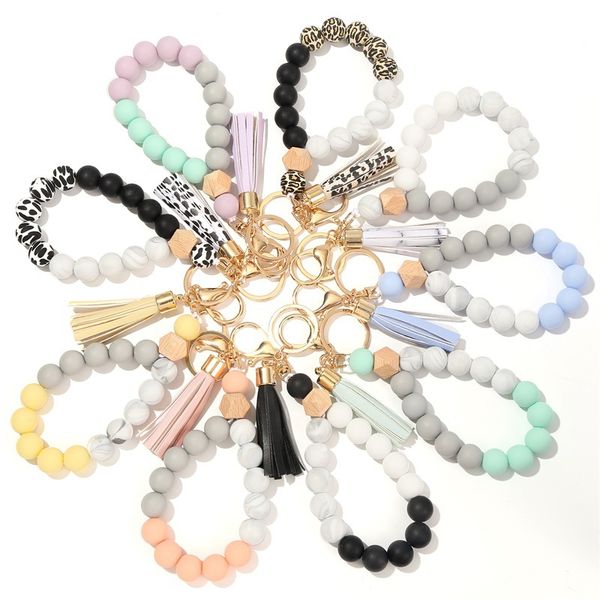 Llaveros para mujer nueva pulsera de llavero con cuentas de silicona de calidad alimentaria pulsera de cuentas de madera de moda llavero con borla de PU llavero antipérdida pulsera de diseñador