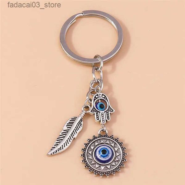 Keychains Lanyards 1pc bohême mal œil oey hamsa main le chain de main pour les femmes hommes bleus oeil plume plume clés sac à anneau pendentif voiture porte-clés anneaux en gros Q240201