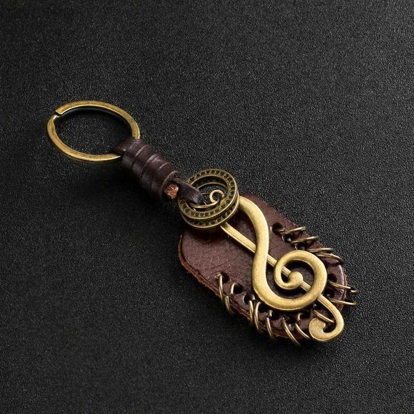 Keychains Lanyards 2024 Fashion Vintage Brown Genuine Leather Wing Compass Música Símbolo Keychain Charm Handwork Accesorios de aleación Men Cadena de teclas D240417