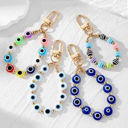 Keychains Lonyards Colorful Circular Evil Eye Eye Course de clés de porte perle adapté aux couples.Bohemian Lucky Blue Eye Bag AirPods Box Car Phone Strap J240509