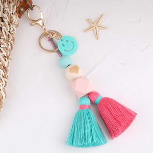 Keychains lanyards kleurrijke houten kralen Tassel sleutelhanger smile face bloem regenboog sleutelring voor vrouwen handgemaakte vriendschap zomer jewelly cadeaus q240403