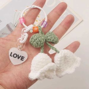 Keychains Lonyards créatifs en tricot d'orchidées Keychain Keillette mignonne douce fleur au crochet Pendre pendentif porte-clés porte-clés femmes sacs décoration Q240429