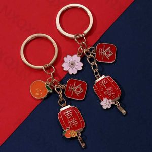 Keychains Lanyards Lintería creativa Flower Naranja Keychain China Cultura tradicional Anillo Año Nuevo Buena Bendición para el Conjunto de Joyas de Friends Q240403