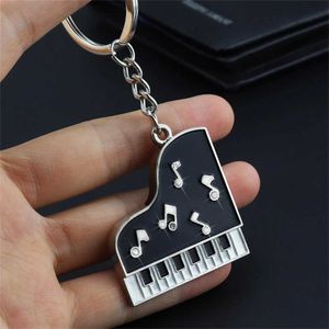 Keychains Lanyards Creatieve piano Keychain Metal Note oortelefoon Key Ring Auto Key Holder Portebasis Paarhanger voor mannen Musician Festival Sieraden Gift