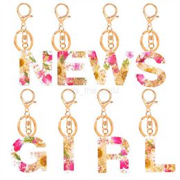 Keychains Lanyards Gedroogde bloem in reliëf Engelse letter Key Chain Populaire kristal drop -gel sieraden sleutelhanger vrouwelijke maisy bloembladen hanger accessoires